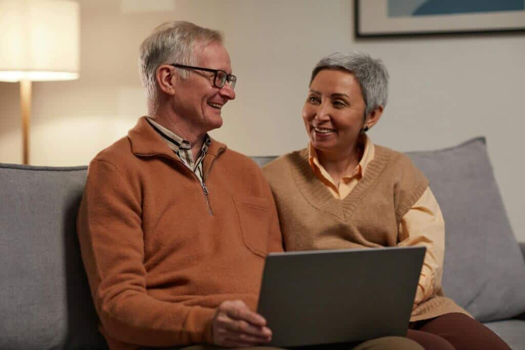two people on laptop